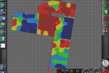 A computer screen displays a detailed map of a building, illustrating precision farming and variable rate spreading techniques.